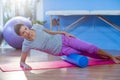 Woman performing exercise using foam roll