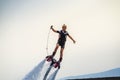 Woman performing Flyboard show at the port of Kalamata city, Greece