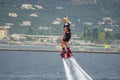 Woman performing Flyboard show at the port of Kalamata city, Greece