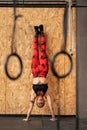 Woman performing handstand exercise in the gym Royalty Free Stock Photo