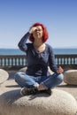 Woman performing joga on energy stones near sea coast Royalty Free Stock Photo