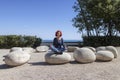 Woman performing joga on energy stones near sea coast Royalty Free Stock Photo