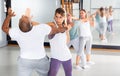 Woman performing palm heel strike while training in gym Royalty Free Stock Photo