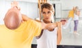 Woman performing palm heel strike while training in gym Royalty Free Stock Photo