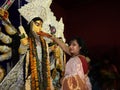 woman performing traditional rituals to hindu goddess& x22;durga& x22;