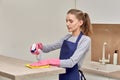 A woman performs routine work in the kitchen. Professional cleaning.