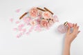 Woman with perfume. Fragrance composition, flowers and cinnamon on white background