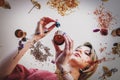 Woman perfumer preparing herbs and flowers for make a perfume. Royalty Free Stock Photo