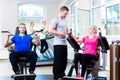 Woman with personal trainer doing sport