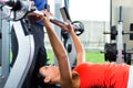 Woman and Personal Trainer in gym Royalty Free Stock Photo