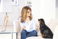 Woman with pet dog at home Royalty Free Stock Photo