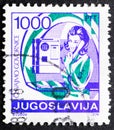 Woman in phone booth in Yugoslavia vintage stamp Royalty Free Stock Photo