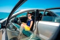 Woman with phone in the car Royalty Free Stock Photo