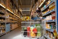 woman with phone checking shopping list app in grocery store Royalty Free Stock Photo