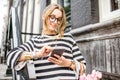 Woman with phone near the house entrance Royalty Free Stock Photo