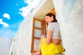 Woman with phone sitting on the window Royalty Free Stock Photo