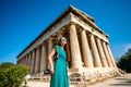 Woman with photo camera near Hephaistos temple in Agora