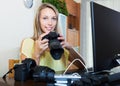 Woman with photocamera and laptop Royalty Free Stock Photo