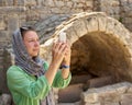 Woman photographed the remains of the ruins Royalty Free Stock Photo