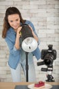 woman photographer with camera taking picture cake