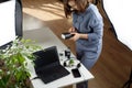 Woman photographer changing batteries in speedlights near her workplace. Freelancer Royalty Free Stock Photo