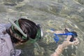 Woman photographer diving into water of Red sea Royalty Free Stock Photo