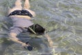 Woman photographer diving into water of Red sea Royalty Free Stock Photo