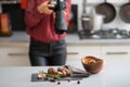 Woman photographer focuses lens autumn fruits and vegetables Royalty Free Stock Photo