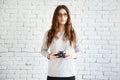 Woman photographer holding a film camera in hands Royalty Free Stock Photo