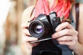 Woman photographer holding old 35mm film camera Royalty Free Stock Photo