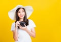 Woman photographer holding vintage digital mirrorless photo camera on hands Royalty Free Stock Photo