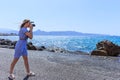 Woman photographer Nature photographer shooting the sea. Travel Concept Royalty Free Stock Photo