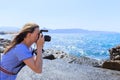 Woman photographer Nature photographer shooting the sea. Travel Concept Royalty Free Stock Photo