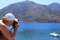 Woman photographer Nature photographer shooting the sea. Travel Concept Royalty Free Stock Photo