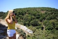 Woman photographer Nature photographer shooting in the mountains. Travel Concept Royalty Free Stock Photo