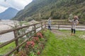 Woman photographer portraying a girl with a beautiful river in the background Royalty Free Stock Photo