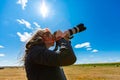 Woman photographer shooting the sky Royalty Free Stock Photo