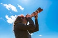 Woman photographer, the sky is the limit. Royalty Free Stock Photo