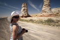 Woman photographer smiling and taking a photo of Elephant Foot Royalty Free Stock Photo