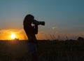 Woman photographer at sunrise Royalty Free Stock Photo