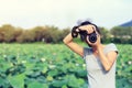 Woman photographer taking photo outdoor