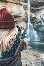 Woman photographer taking photo of waterfall Royalty Free Stock Photo