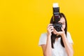 Woman photographer taking picture and looking viewfinder on digital mirrorless photo camera Royalty Free Stock Photo