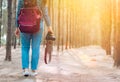 Woman photographer walking in the forest Royalty Free Stock Photo