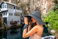 Woman photographing in Blagaj village Royalty Free Stock Photo