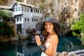 Woman photographing in Blagaj village Royalty Free Stock Photo