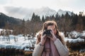 Woman photographing with retro instant film camera Royalty Free Stock Photo