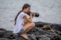 Woman photographing sea lion feel hot weather