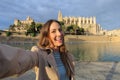 Woman photographing a selfie in Palma de Mallorca Cathedral