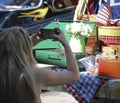 A Woman Photographs a Display at a Vintage Car Show in Santa Fe